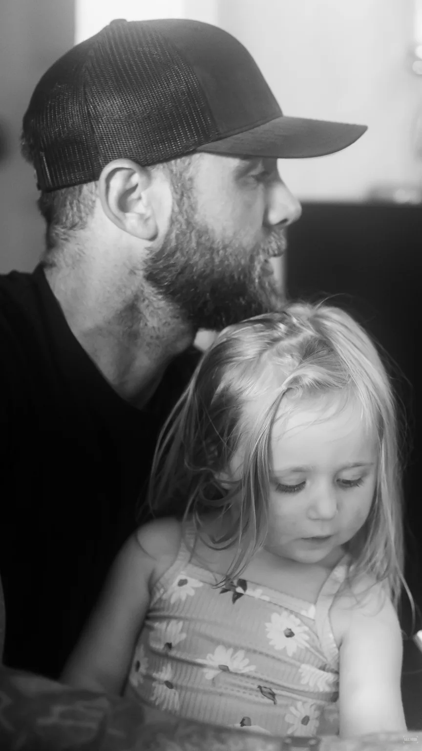Unposed black-and-white family moment.