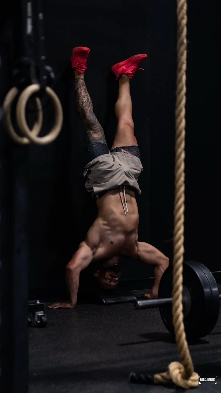 Athlete mid-handstand.
